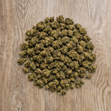 Fleurs CBD 100g Harlequin en vue du dessus. Petites têtes séchées issues de chanvre conforme à la réglementation européenne.