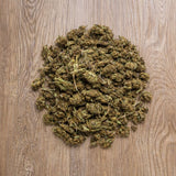 Fleurs CBD 100g Lemon présentées en vue du dessus. Petites têtes séchées issues de chanvre conforme à la réglementation européenne.