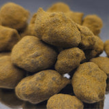 Accumulation de MoonRocks de CBD à 60%, montrant la texture poudreuse caractéristique du kief recouvrant les fleurs infusées à la wax.