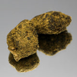 Photo de la Moonrock CBD Bio de Gr33nz, enrobée d'huile de CBD et recouverte de kief pour une puissance maximale et 70% de CBD.