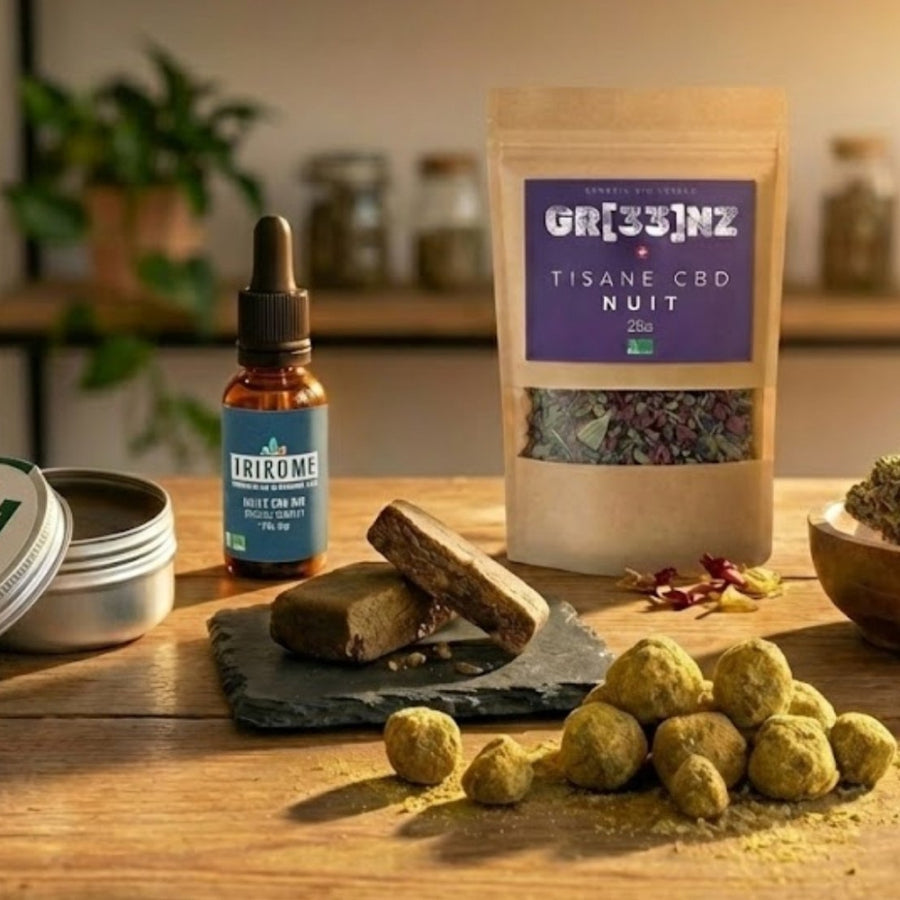 Vue d'ensemble des produits GR33NZ sur une table en bois, présentant un sachet de tisane cbd Nuit, un flacon d'huile, des baumes et des extraits de résine bio.