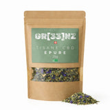 Image présentant la tisane bio « épure » GR33NZ, un mélange artisanal associant 25 % de chanvre CBD bio à des plantes issues de l’agriculture biologique (citronnelle, origan, thym citronné)